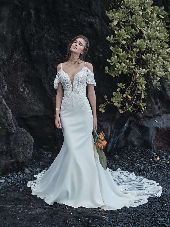 Bride on Beach Wearing Cold Shoulder Sleeve Sheath Wedding Dress Called Bracken Made by Sottero and Midgley