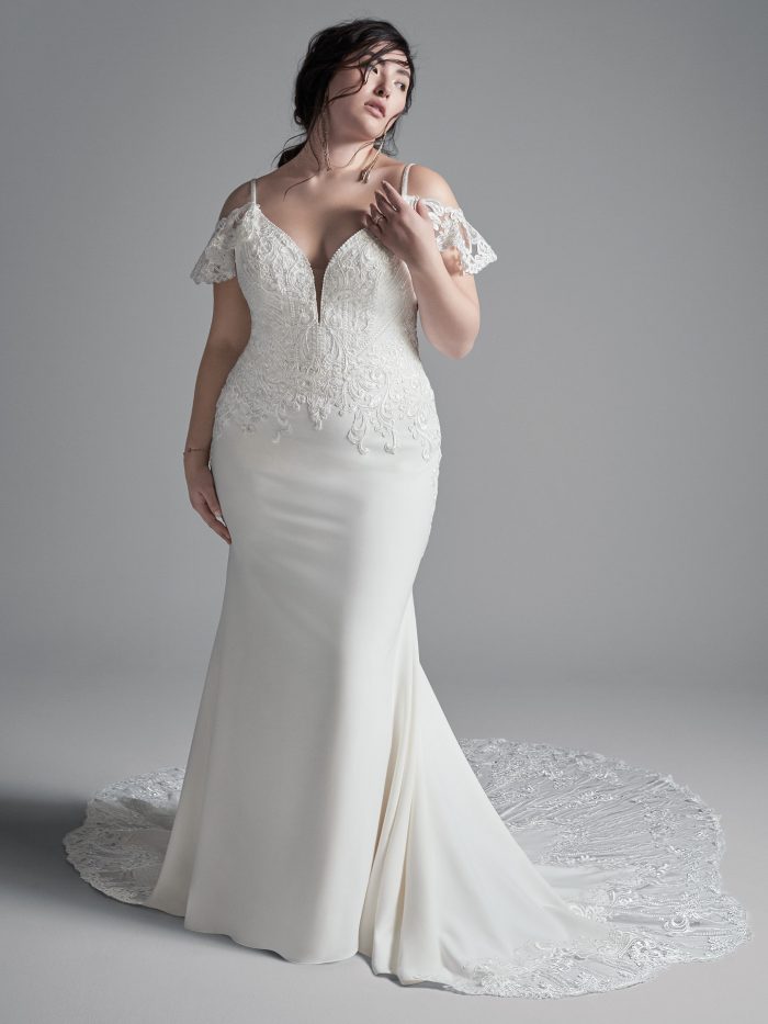 Curvy Model Wearing Plus Size Cold Shoulder Sleeve Wedding Dress Called Bracken Made by Sottero and Midgley