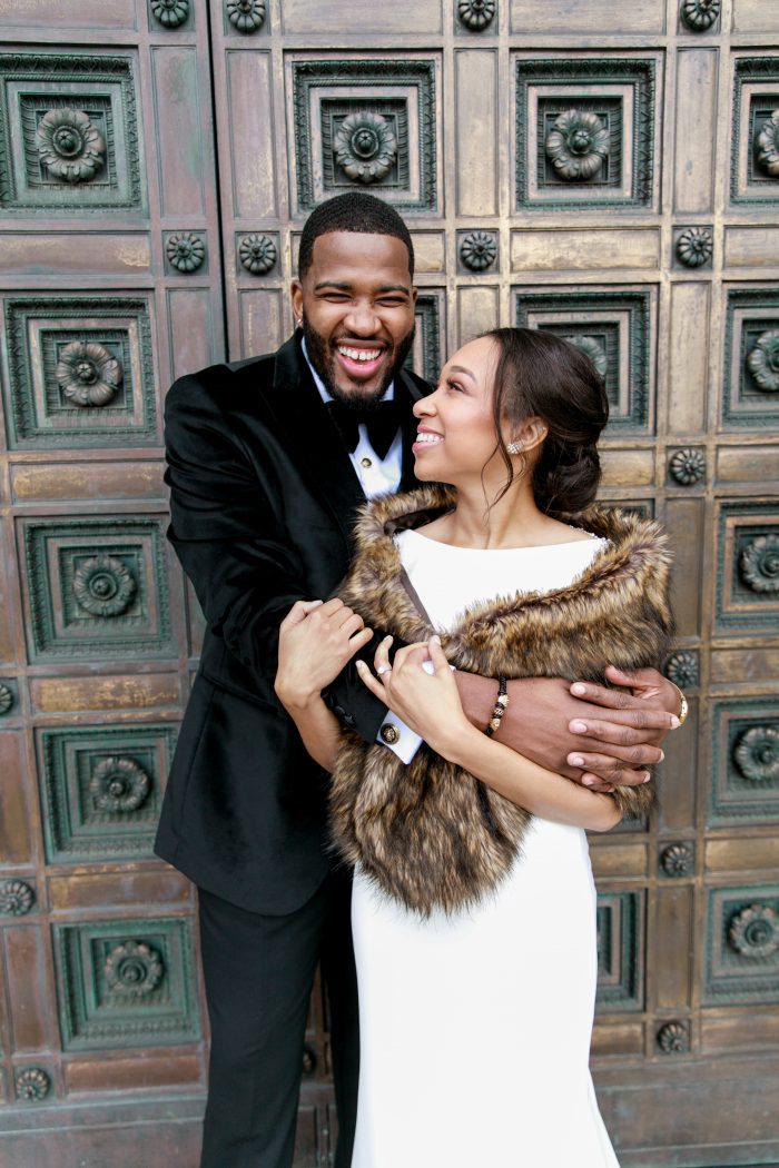 Groom Holding Real Bride Wearing Chic Elegant Wedding Dress Called Evangelina by Maggie Sottero