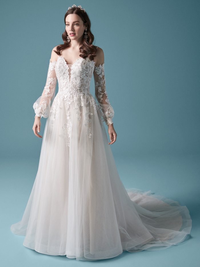 Model Wearing Cold Shoulder Bishop Sleeve Princess Wedding Dress Called Stevie by Maggie Sottero