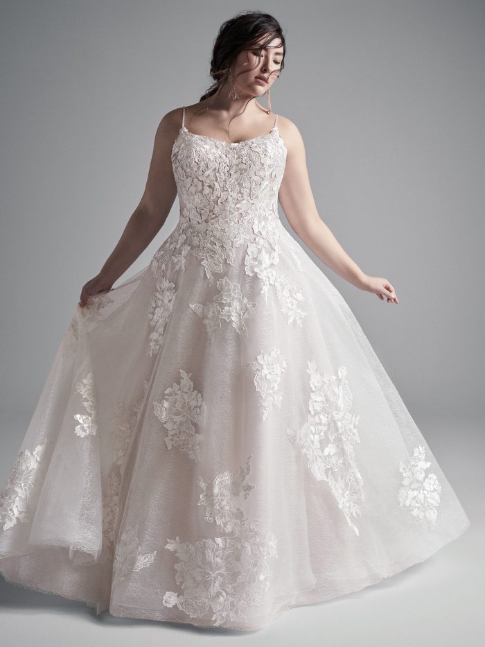 Plus Size Model Wearing Plus Size Floral Lace A-line Wedding Gown Called Houston by Sottero and Midgley