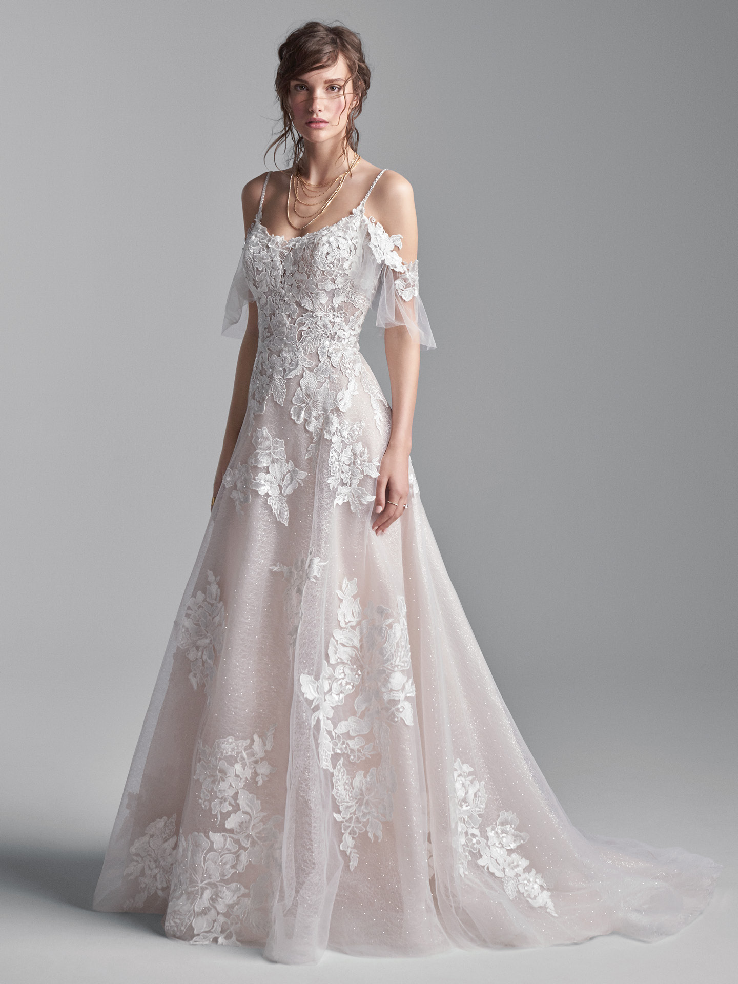 Model Wearing Cold Shoulder Floral Lace A-line Wedding Gown Called Houston by Sottero and Midgley