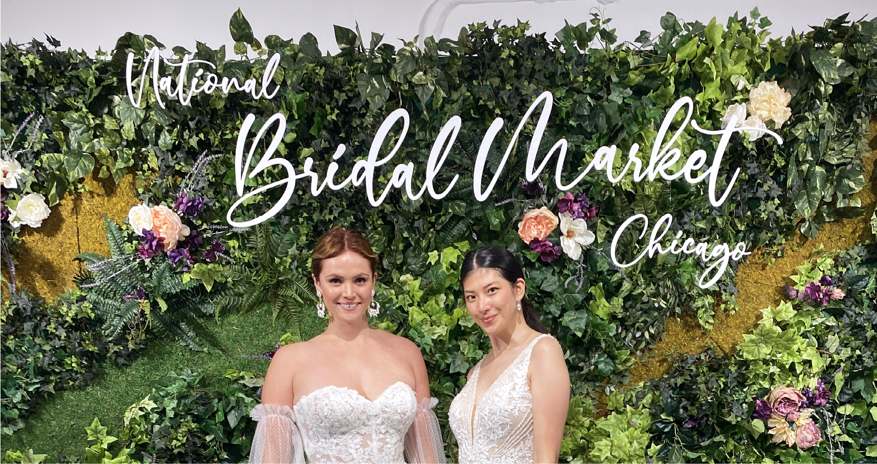 Two Models in Maggie Sottero Wedding Dresses Standing in front of Chicago Bridal Market Sign