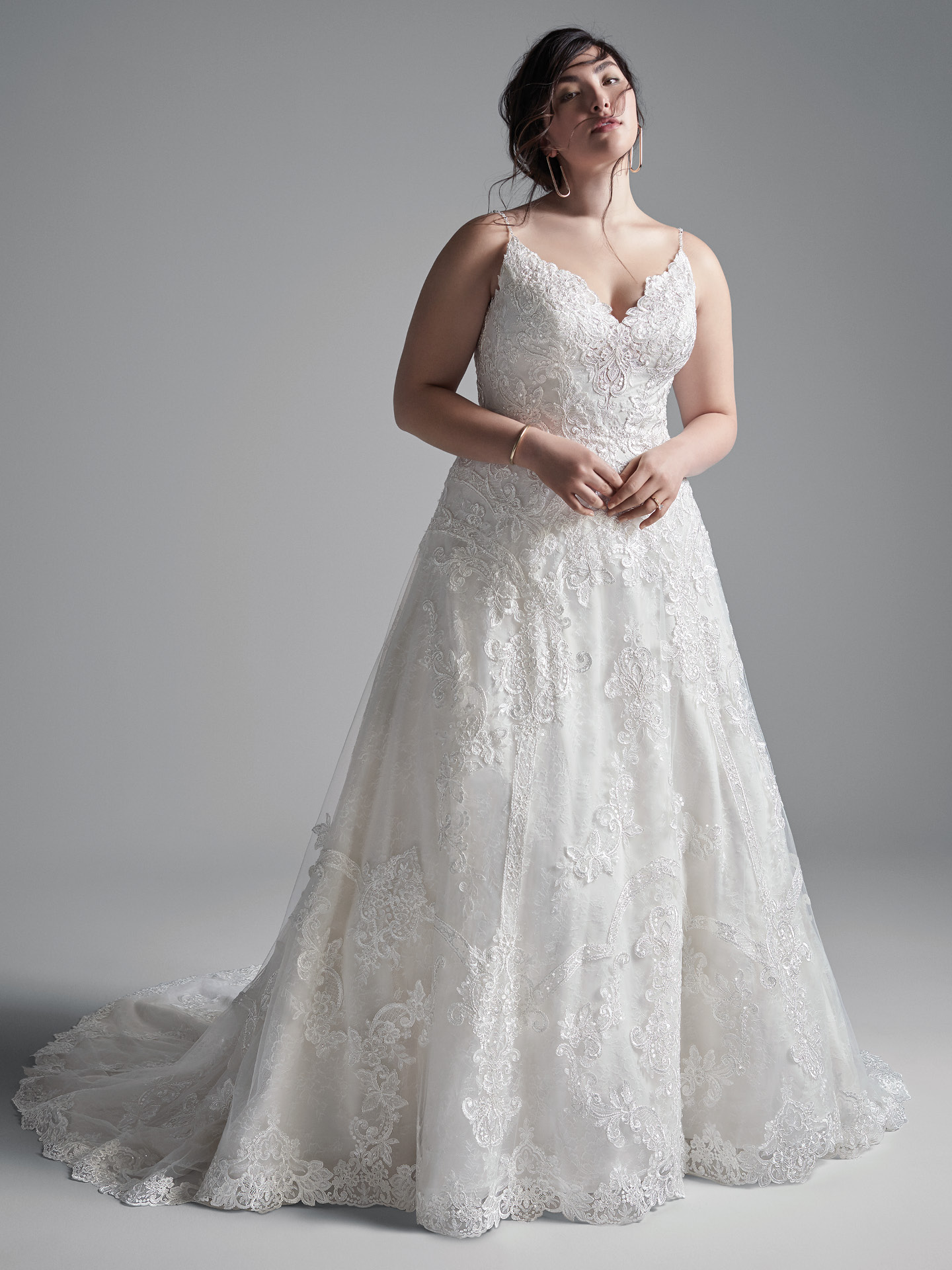 Plus Size Model Wearing Plus Size Lace A-line Wedding Gown Called Lancaster by Sottero and Midgley