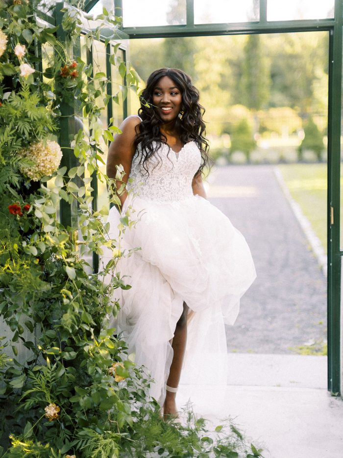 Bride in Greenhouse Wearing A-line Wedding Dress Called Marisol by Rebecca Ingram