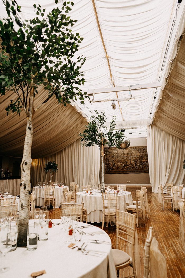 Indoor Venue with Trees and Boho Wedding Details