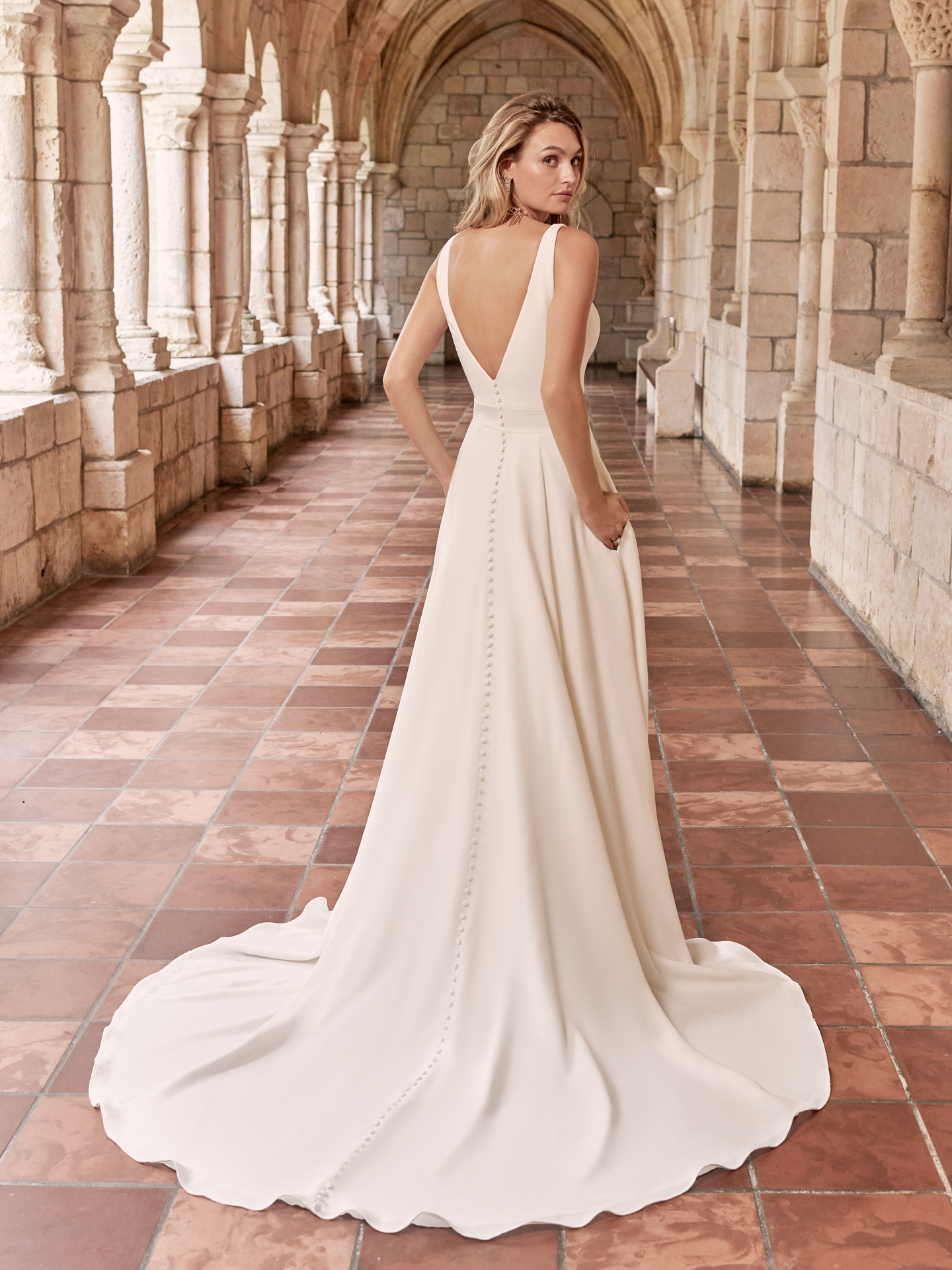 Model Wearing V-back Crepe A-line Wedding Dress Called Josephine by Maggie Sottero