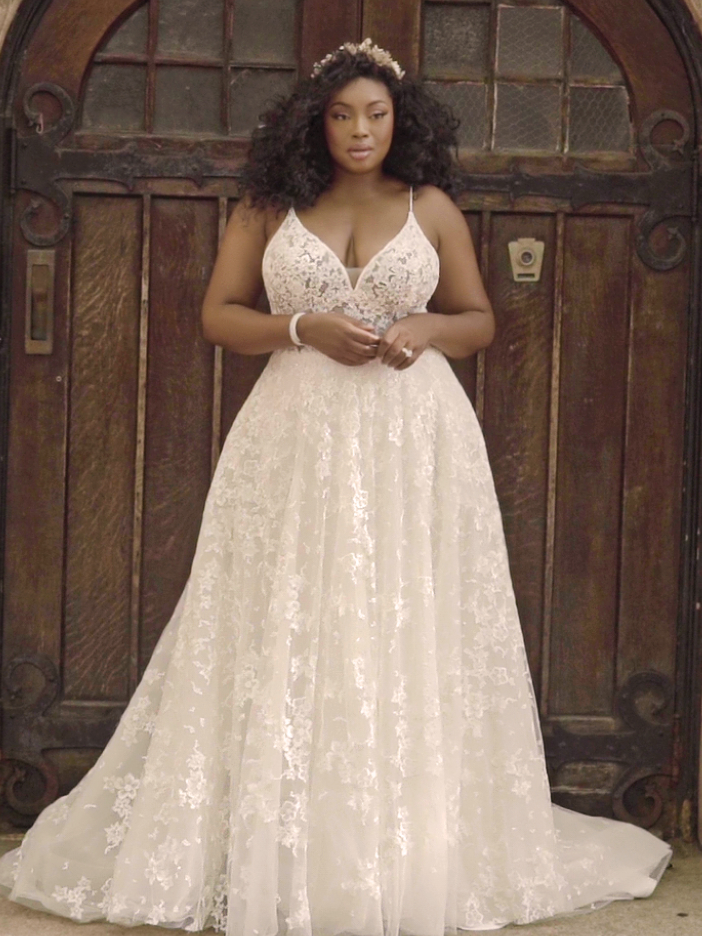 Black Model Wearing Plus Size A-line Wedding Dress Called Lorenza by Maggie Sottero