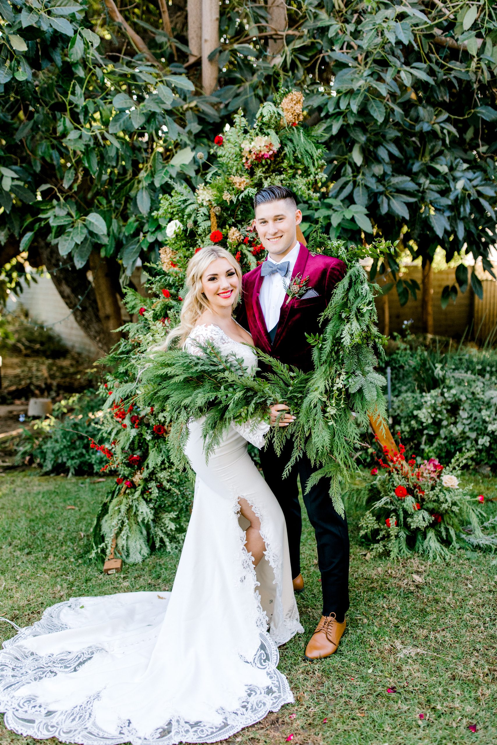 Groom in Velvet Suit with Real Bride Wearing Luxe Crepe Bell Sleeve Wedding Dress Called Armante by Sottero and Midgley