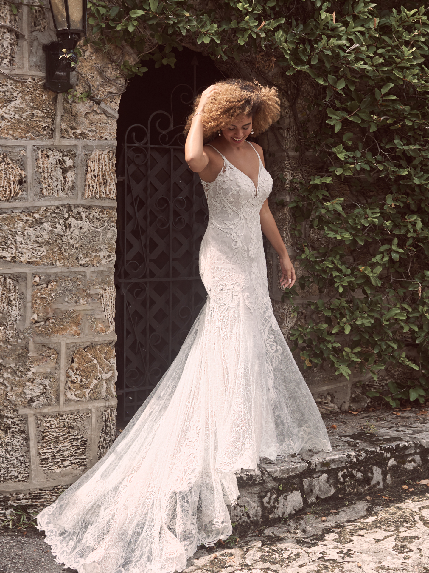Model wearing Sexy Lace Mermaid Wedding Gown Esther by Maggie Sottero