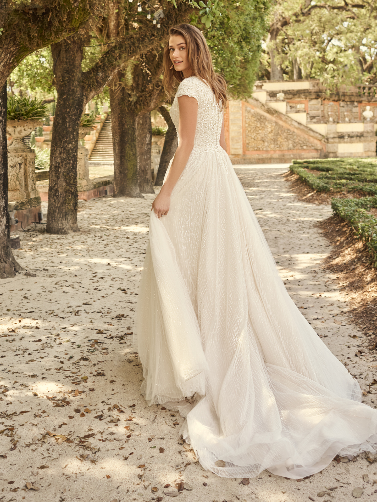Bride Wearing Modest Cap-Sleeve Princess Wedding Dress Called Pearson by Maggie Sottero