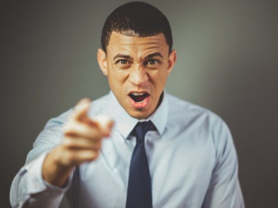 man wearing white dress shirt with black necktie