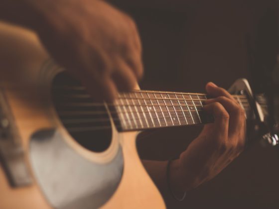 person playing guitar