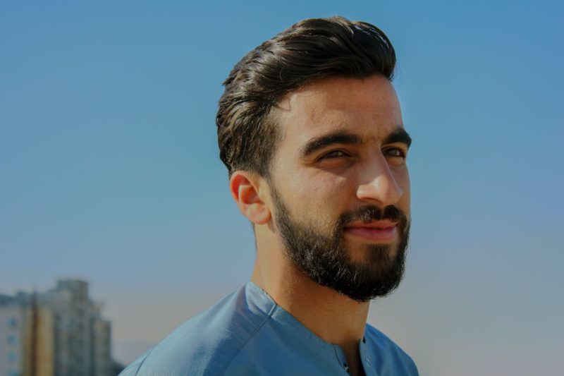 man in blue top