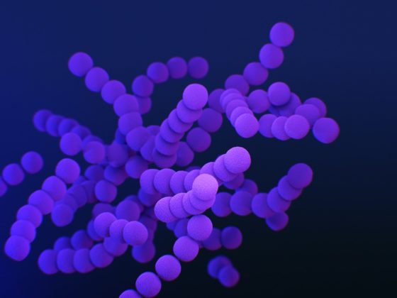 a bunch of purple balls are in the air