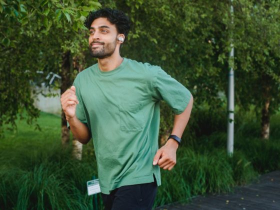 bearded man wearing green shirt running