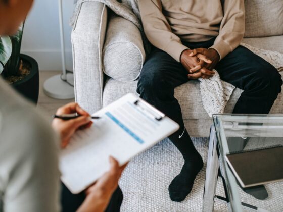 crop ethnic client discussing problems with anonymous psychologist