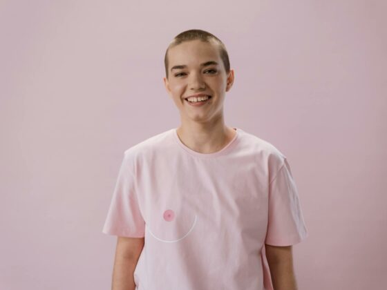 smiling woman in pink shirt